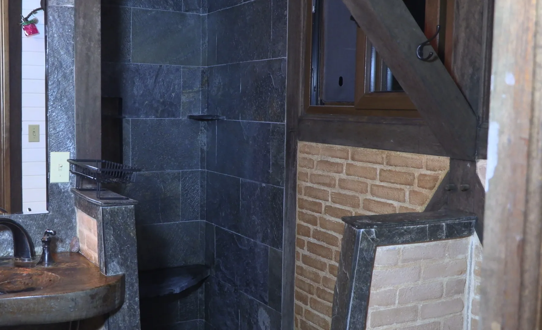 Stone-tiled bathroom inside the Owner House