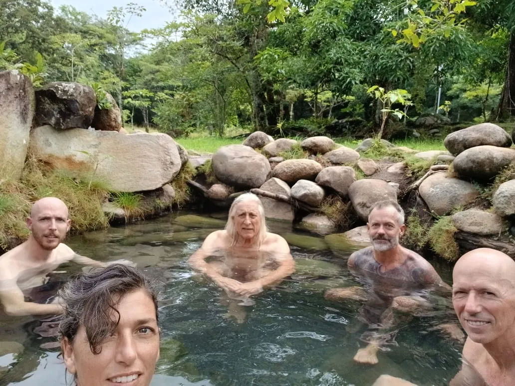 A group of friends soaking together in one of the pools