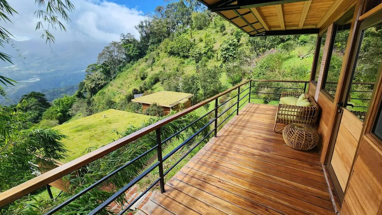 Cabin exterior grown into the cloud forest at Wild on the Farm