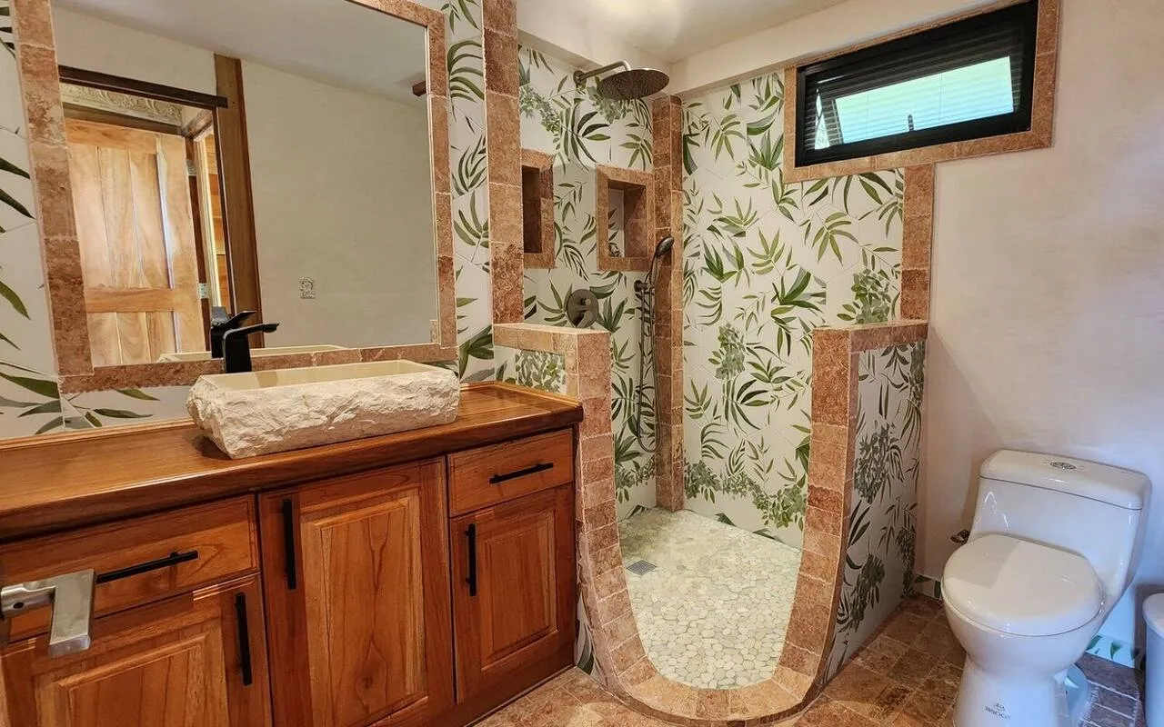 Cabin One bathroom with hand-painted leaf tile