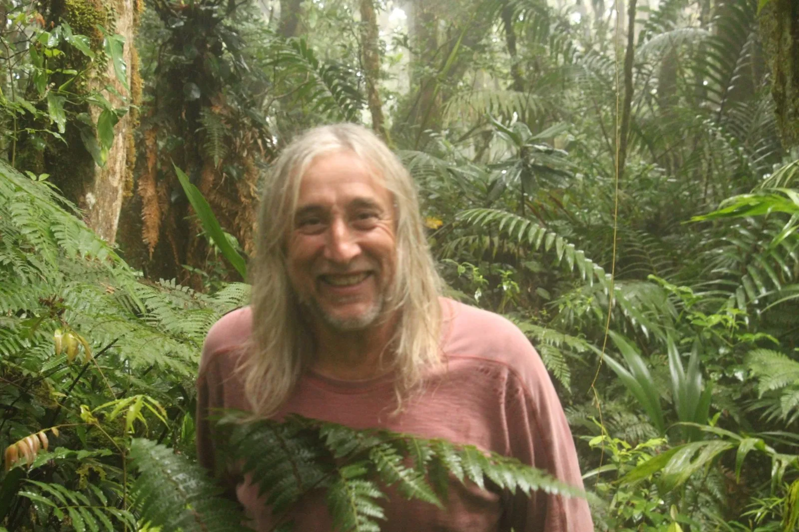 The guide smiling among the tree ferns