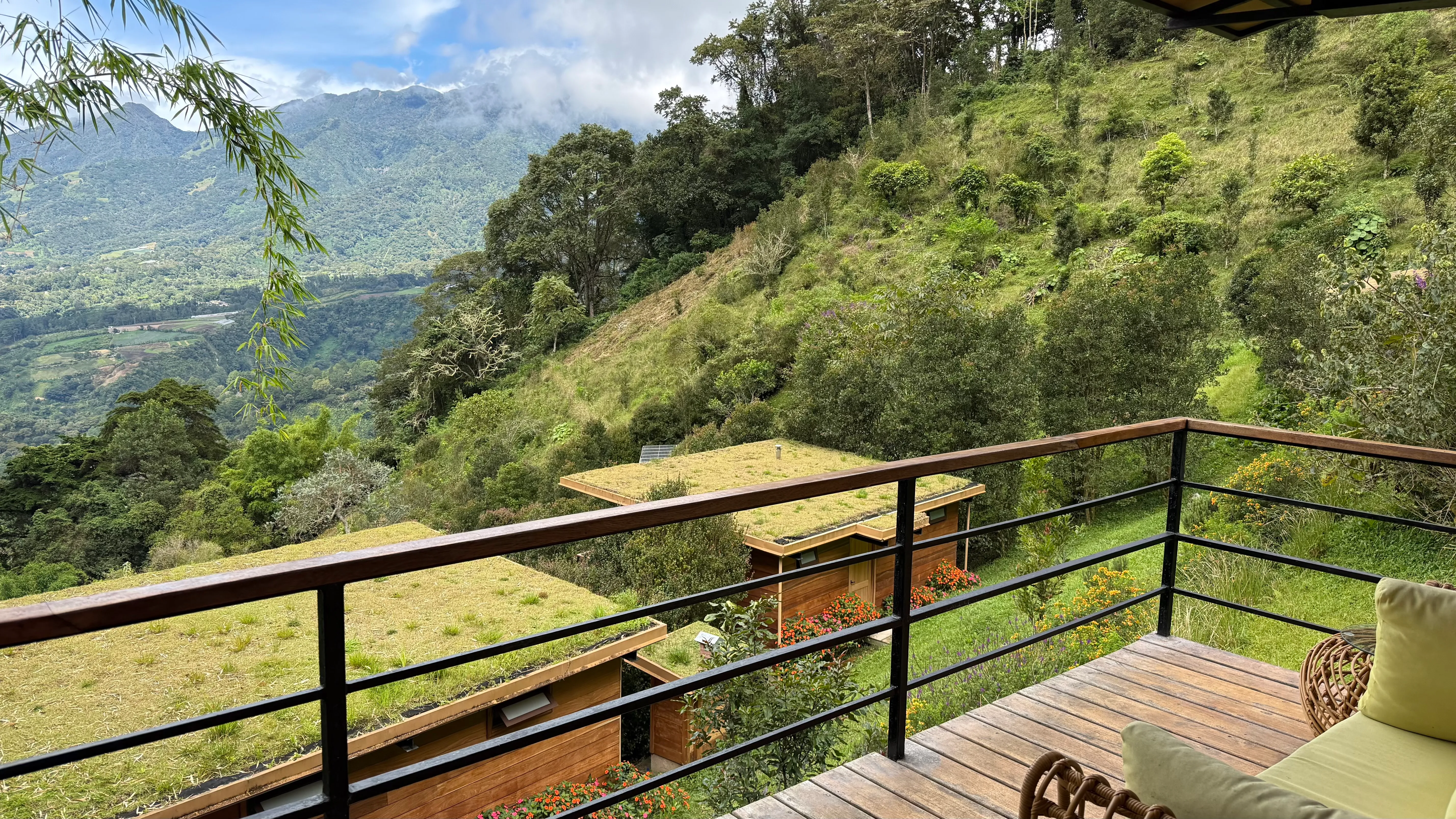 View from a cabin balcony over the living roofs and the Chiriquí valley