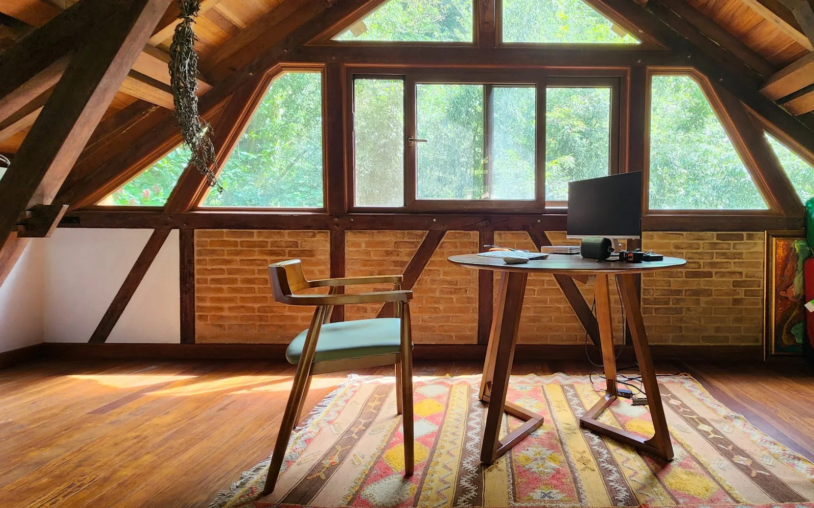 Loft office under the roof beams of the Owner House