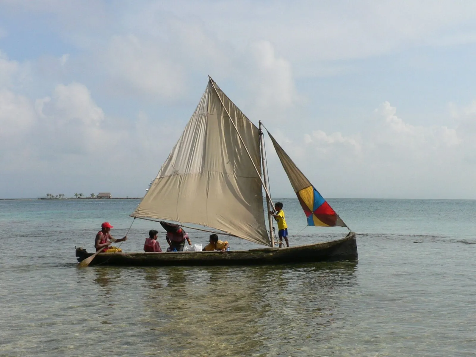 A Guna sailing ulu with a patchwork sail near the San Blas islands